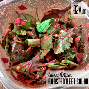 The beets and Dijon mustard blend together to coat the greens in a delicious pink dressing.
